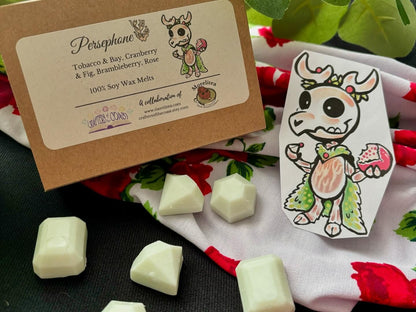 6 green wax melts that smell like tabacco, bay, cranberry, fig, brambleberry, and rose